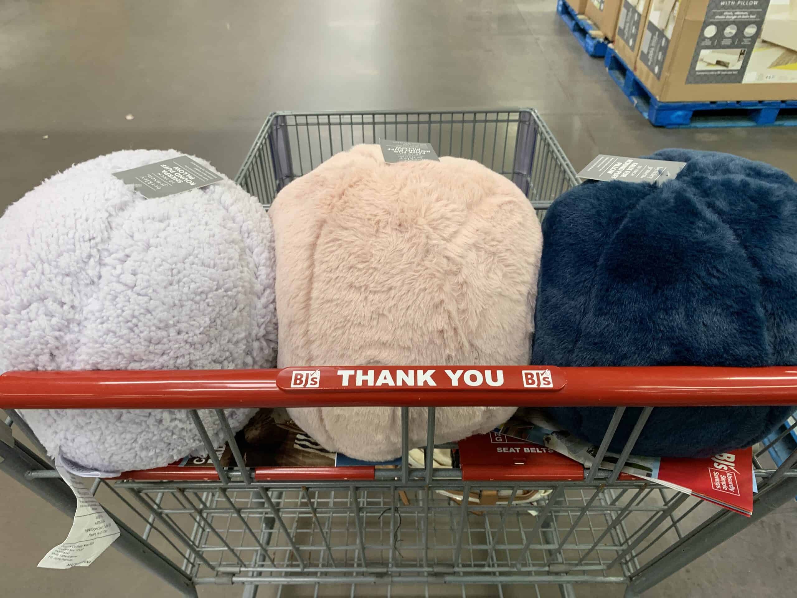 assorted sherpa or faux fur solid puff pilows at BJs