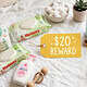 Baby care products including diapers, wipes, and lotion on a soft surface.