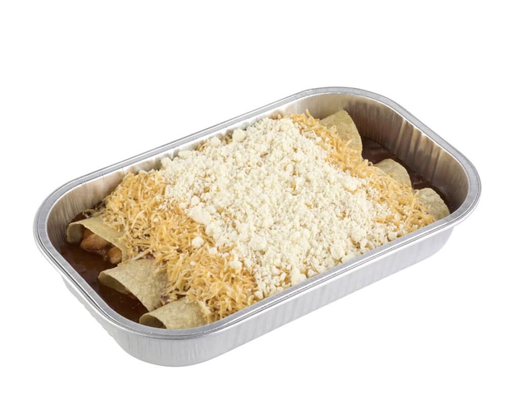 Uncooked enchiladas with cheese and sauce in a foil tray.