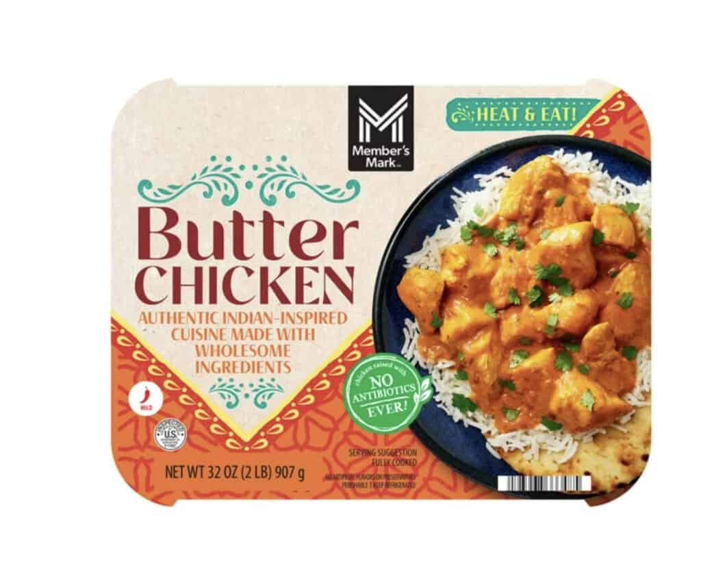 Frozen butter chicken meal with rice, fresh herbs, and creamy sauce.